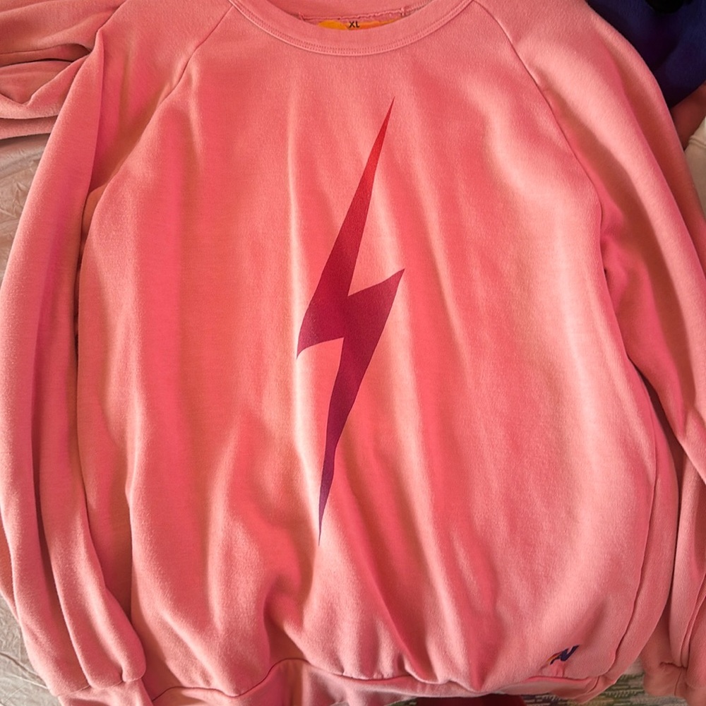 Pink lightning mark crewneck from aviator nation.